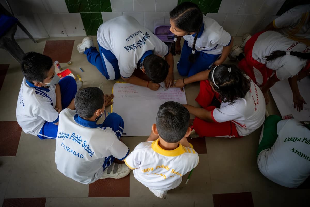 Students working together on a poster project
