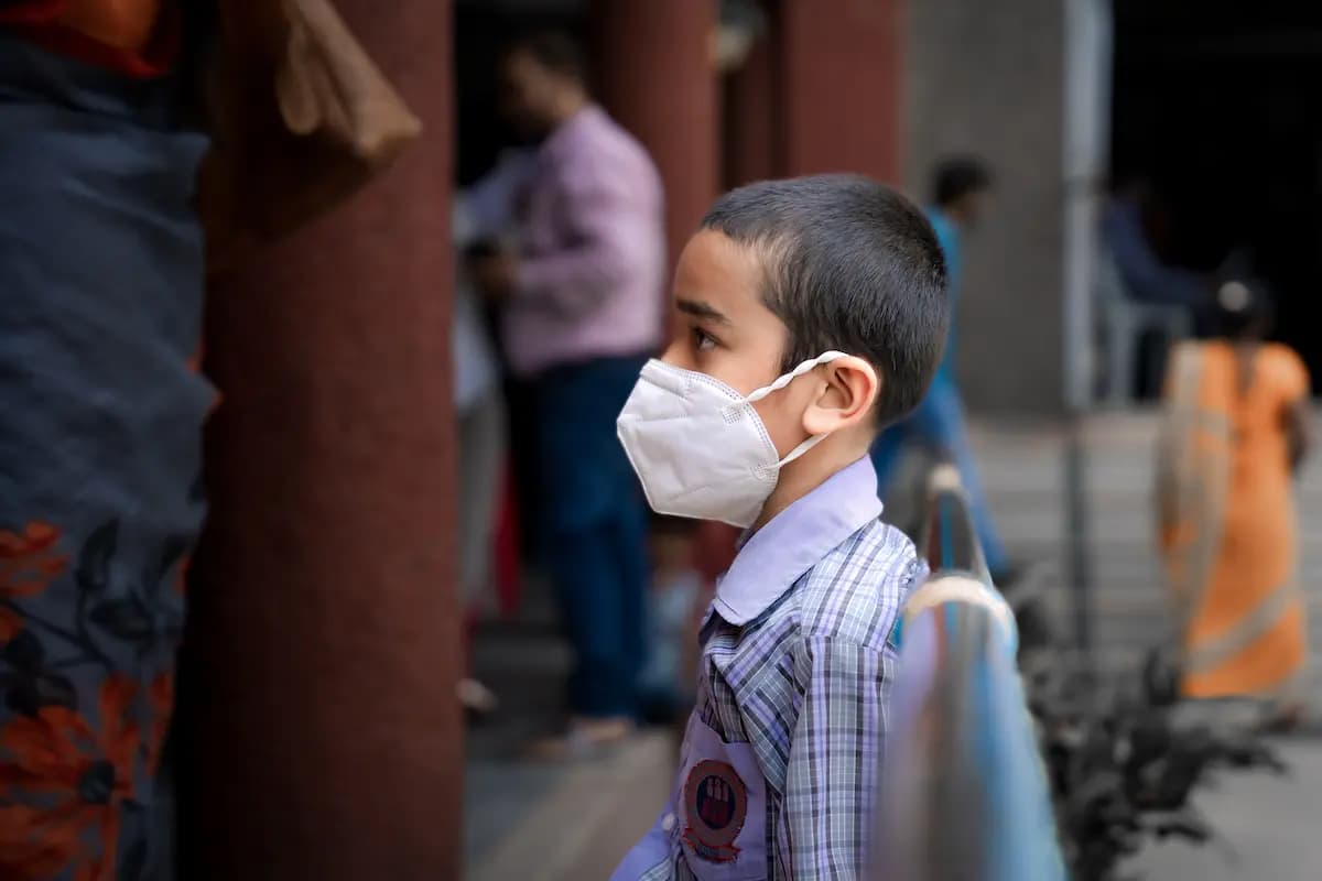 A quiet moment between two young students in the school corridor