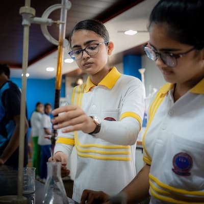 Two students running an experiment in the chemistry lab